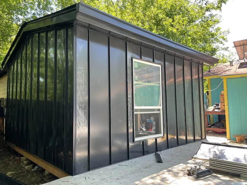 Black standing seam metal wall panels for Roof Inspection in West Slope