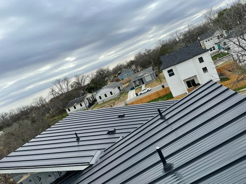 Standing seam metal roof panels with vents for Skylight Repair in West Slope